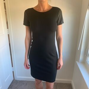 Black tshirt dress with leather sleeves and side accents